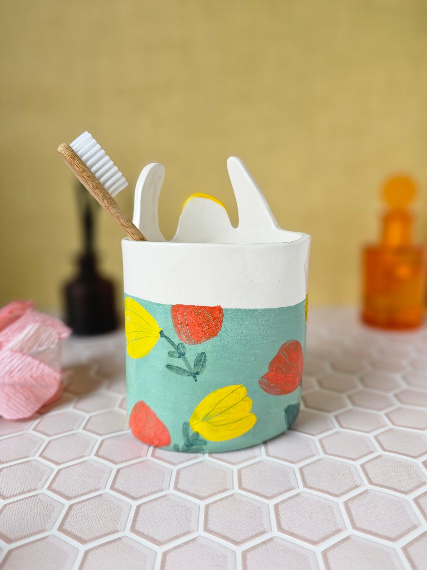 Marigold the swimmer ceramic toothbrush holder