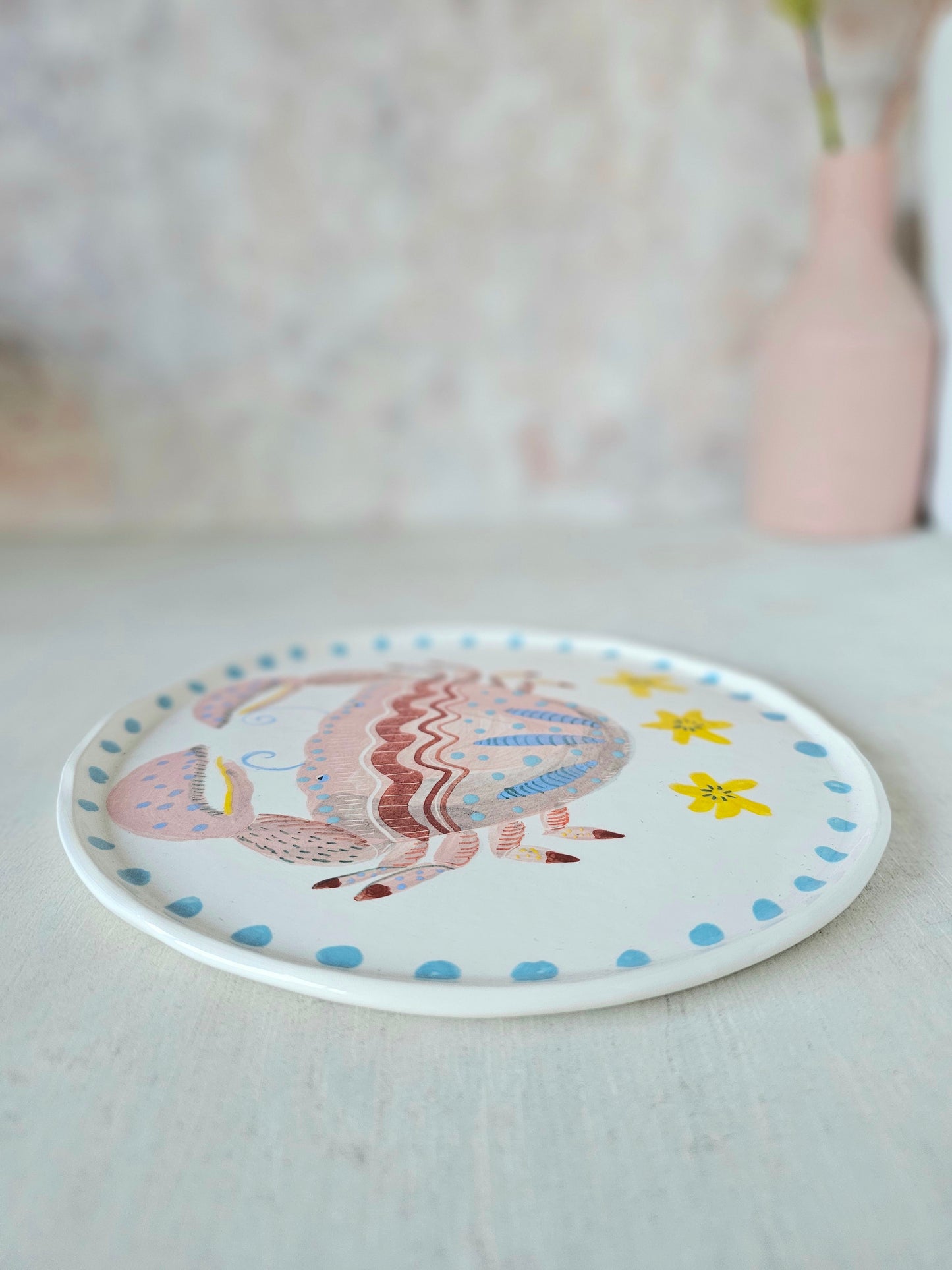 Crabby tonga decorative hand painted ceramic plate .