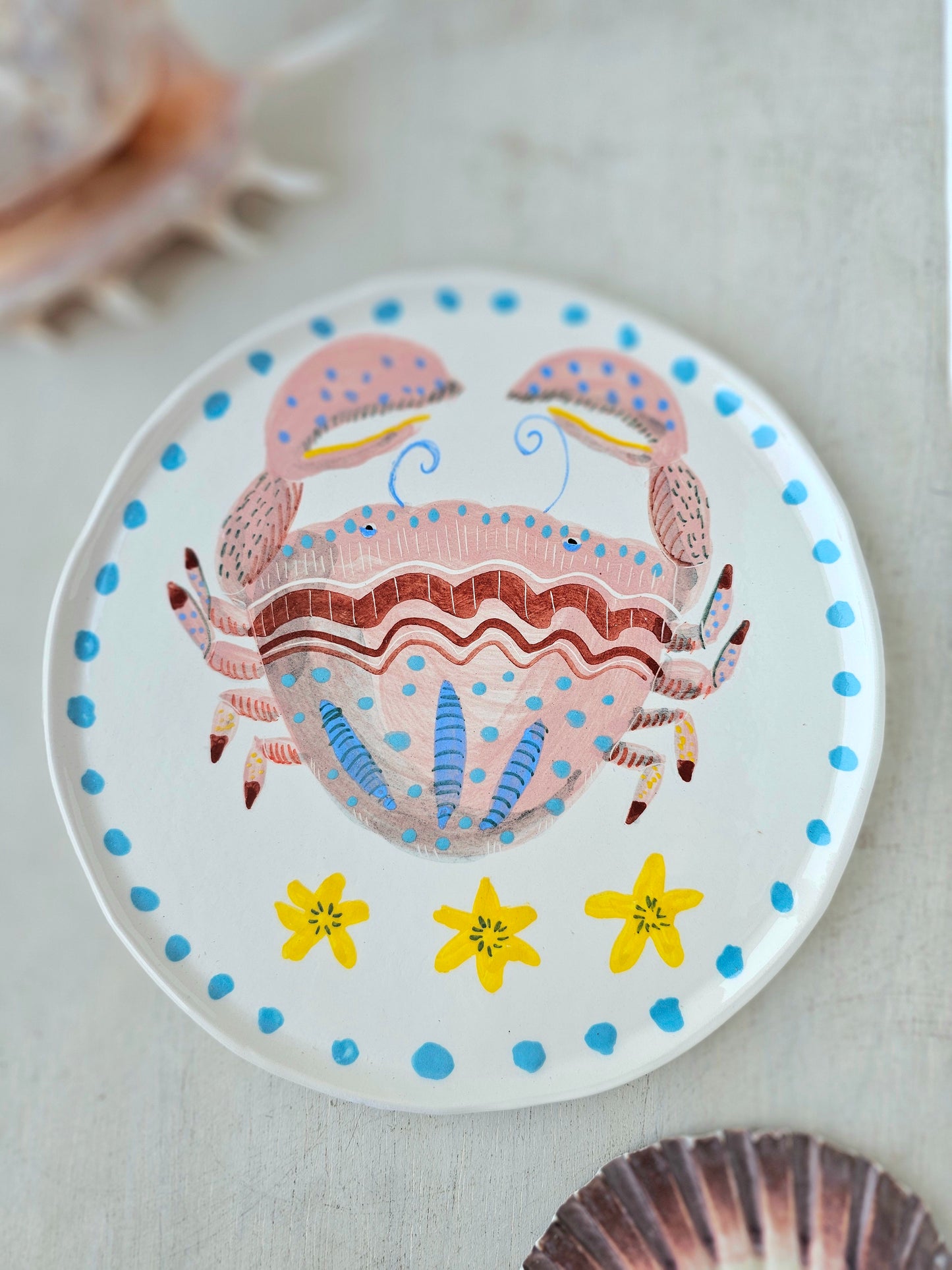 Crabby tonga decorative hand painted ceramic plate .