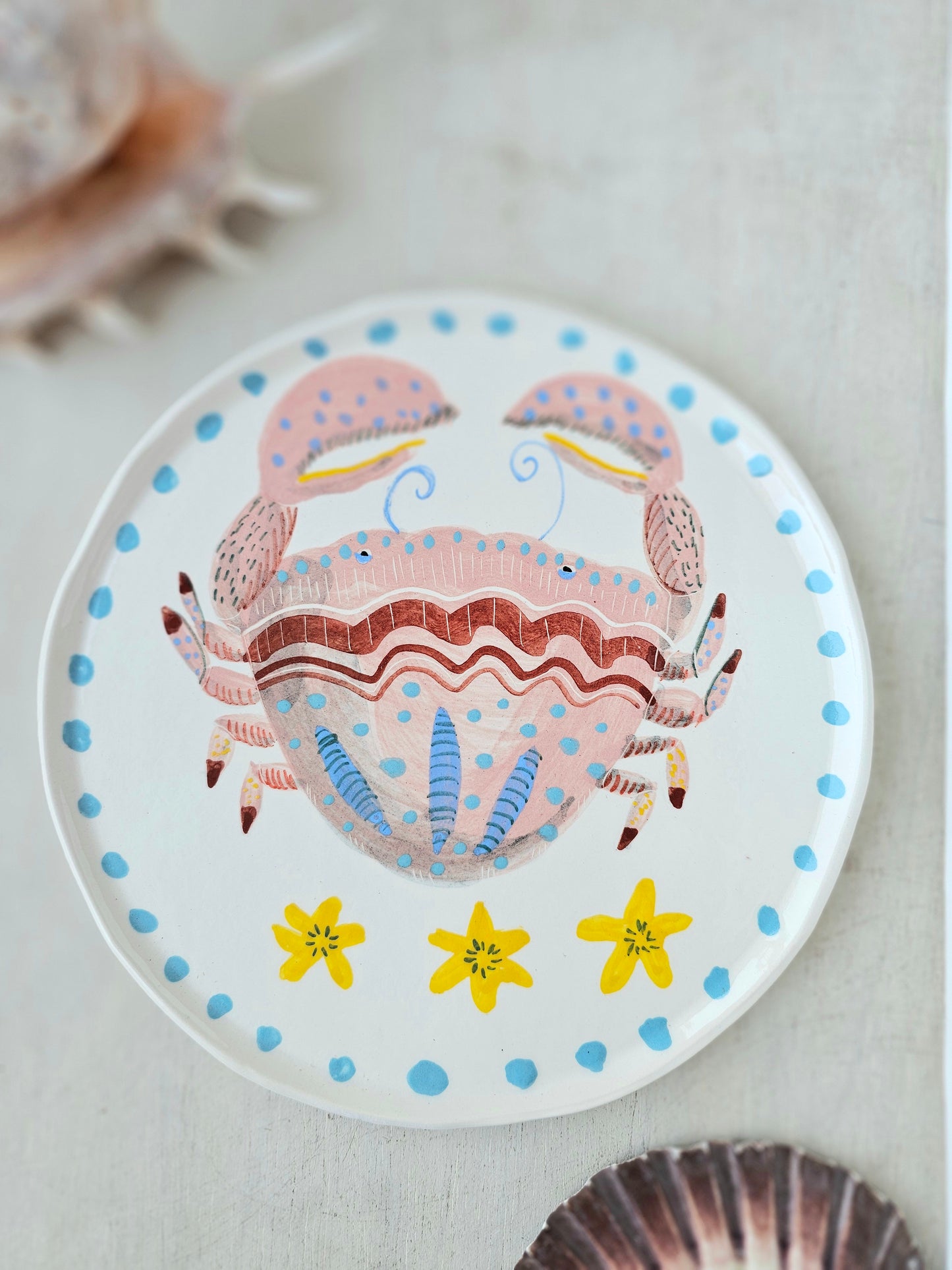 Crabby tonga decorative hand painted ceramic plate .