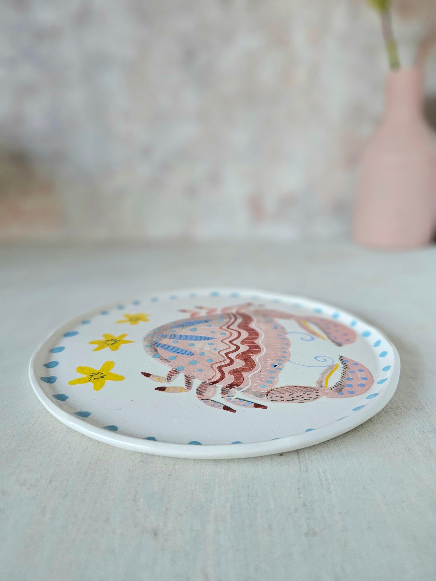 Crabby tonga decorative hand painted ceramic plate .