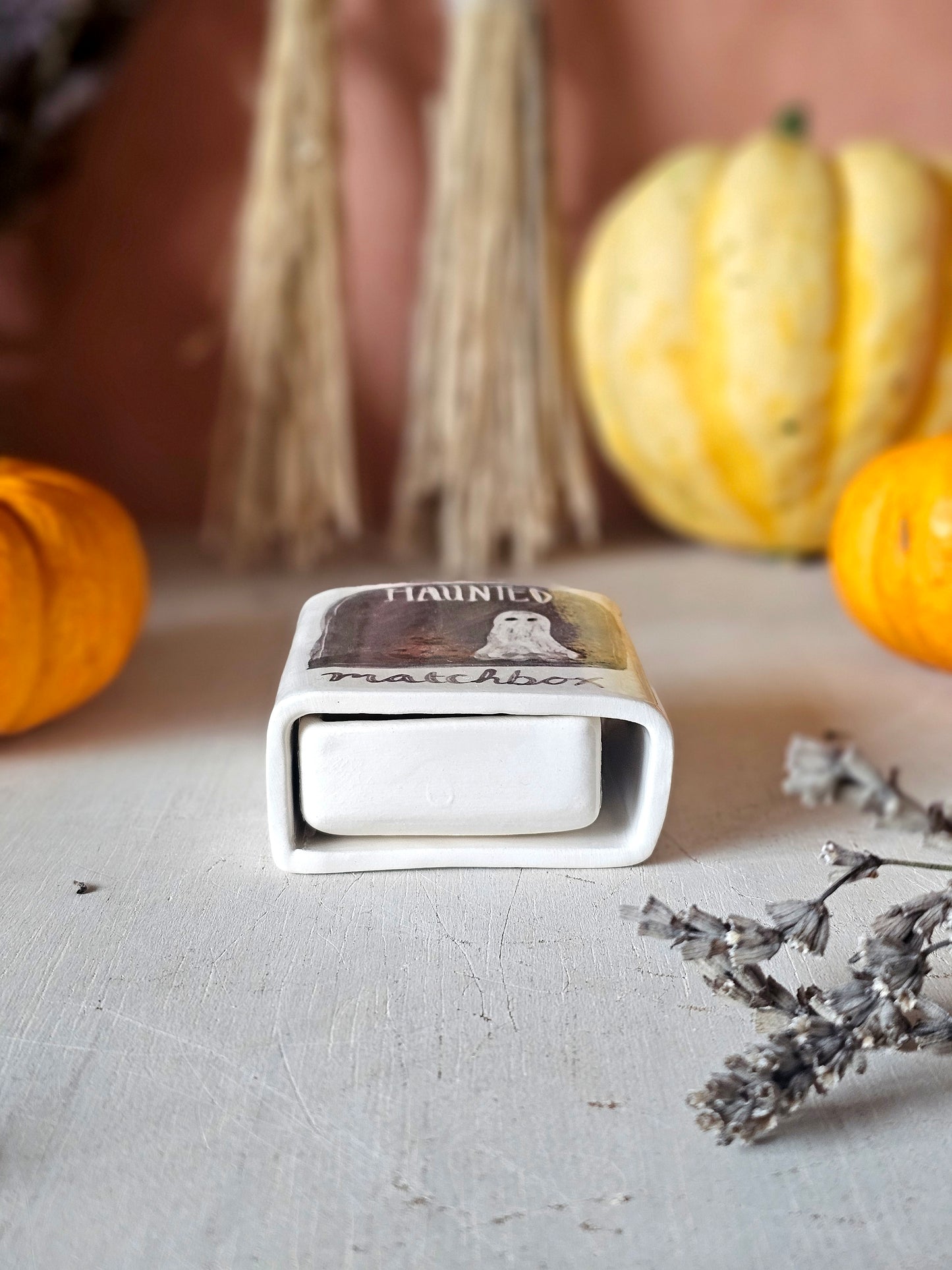 The haunted small ceramic matchbox with mini ghost