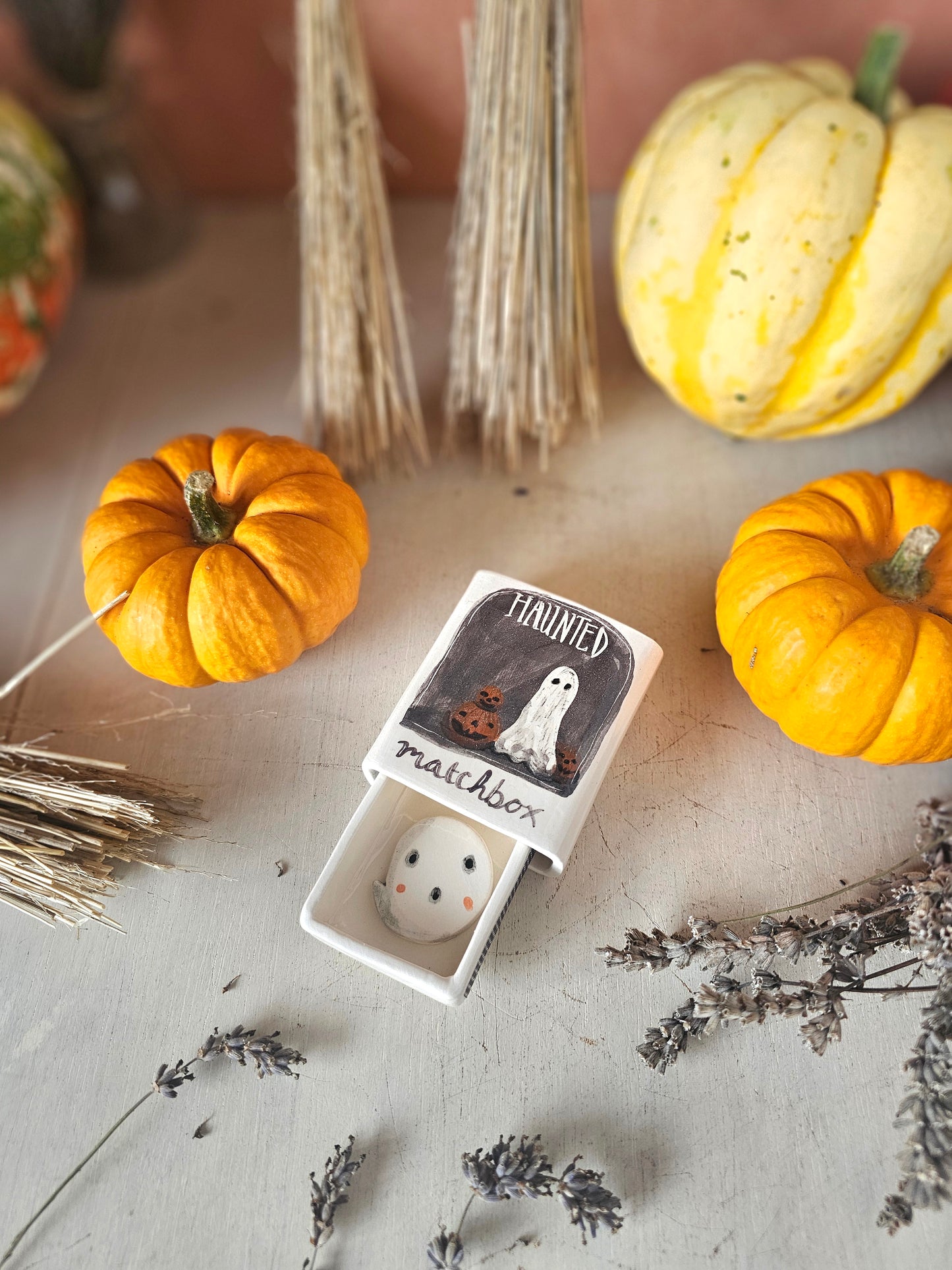 The haunted small ceramic matchbox with mini ghost