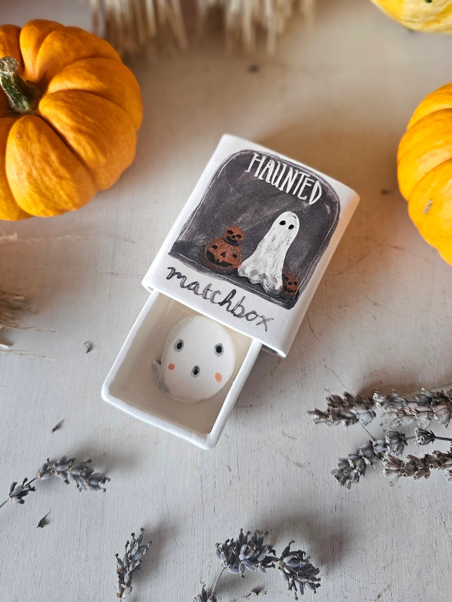 The haunted small ceramic matchbox with mini ghost