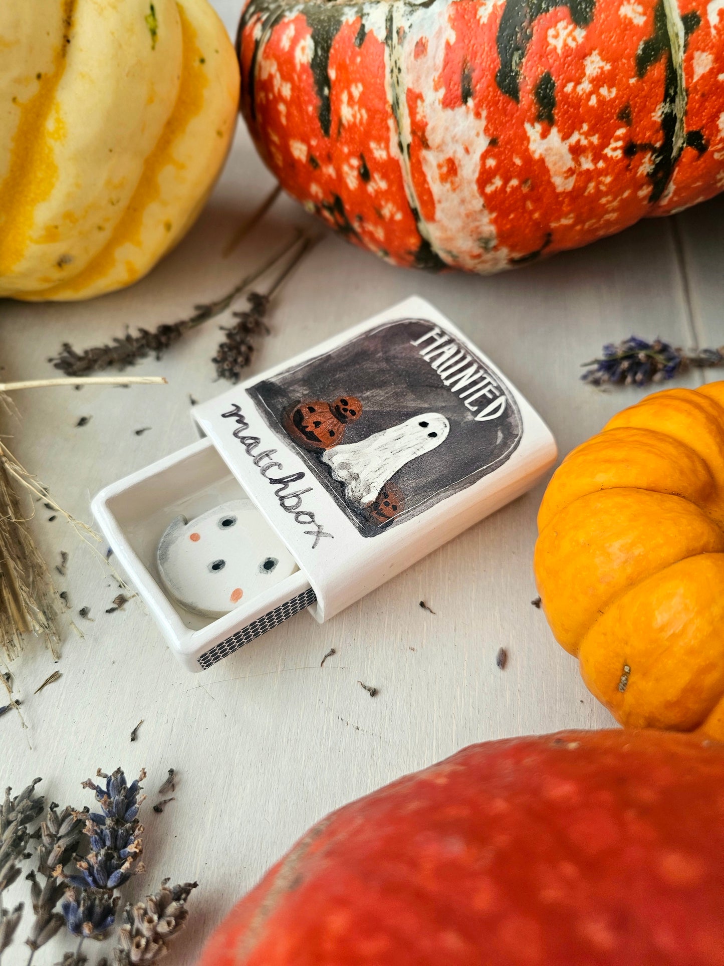 The haunted small ceramic matchbox with mini ghost