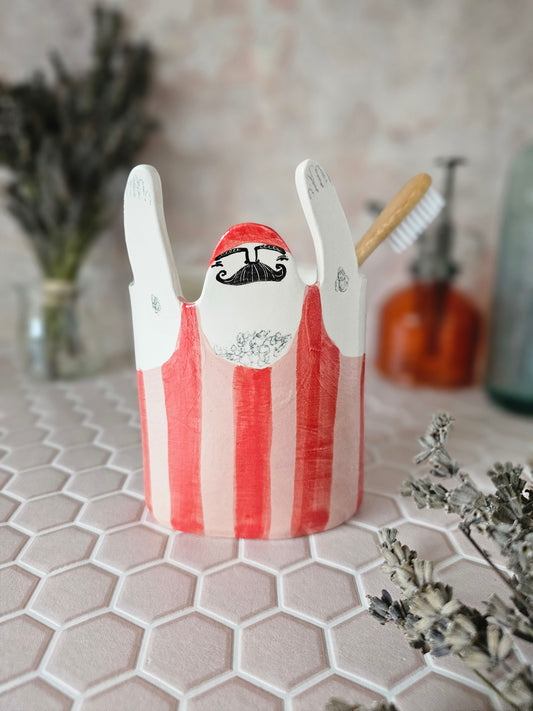 Hector the strongman ceramic toothbrush holder