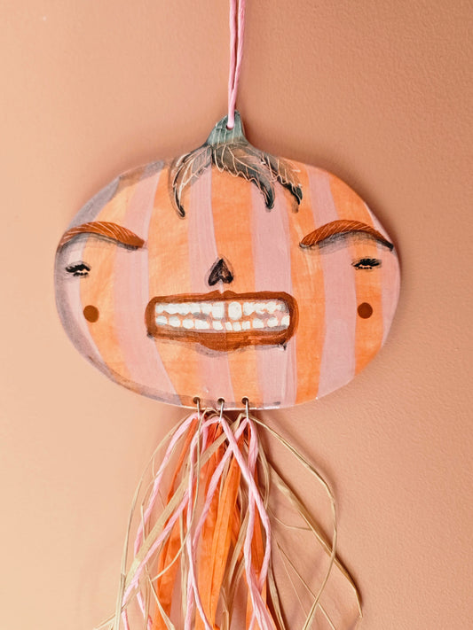 Grinny Ginnie – Female Pumpkin Head with Straw Décor