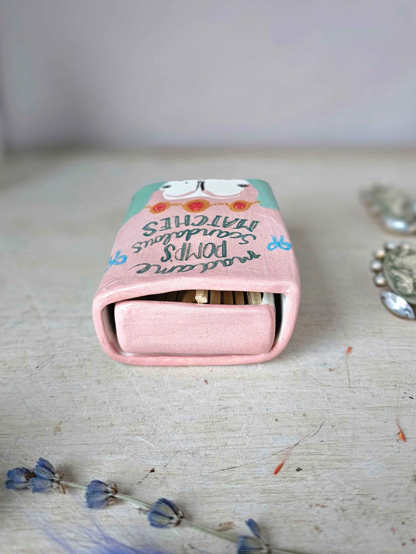 Madame Pomp's Scandalous matches small ceramic matchbox